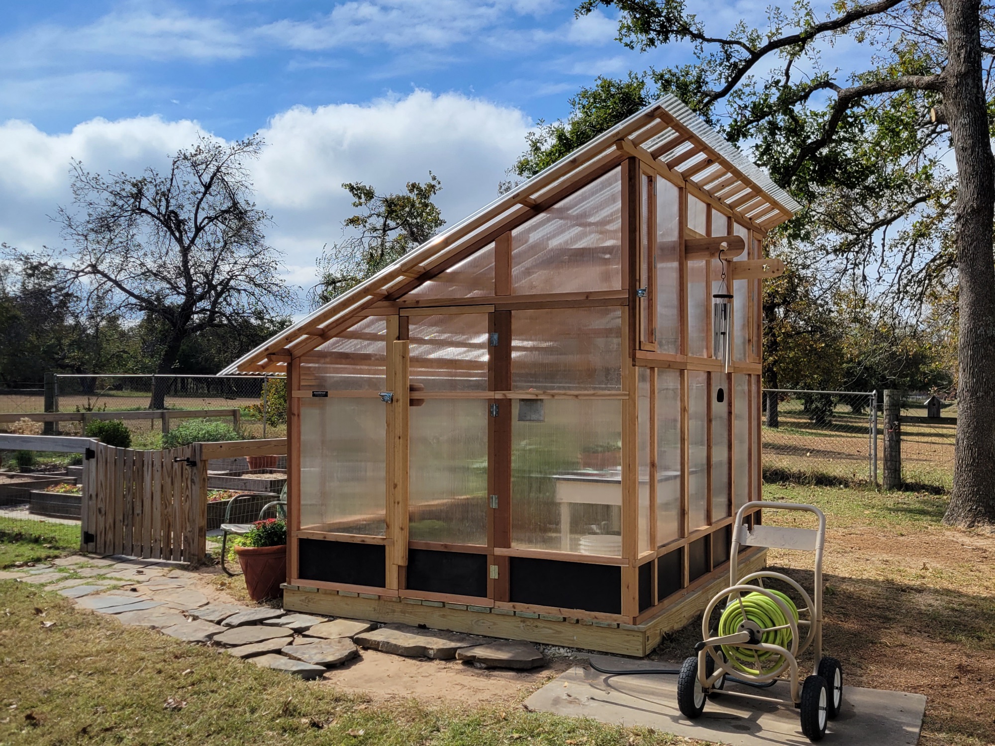 Slant Roof Greenhouse Customer Image In Garden