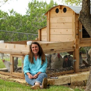 Dyan Twining sitting in front of chicken coop